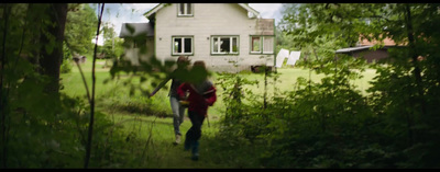 a couple of people that are walking in the grass