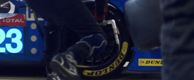 a close up of a person standing next to a motorcycle