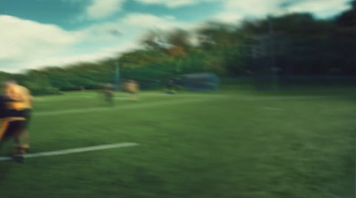 a blurry photo of a person on a soccer field