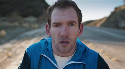 a man standing in the middle of a road