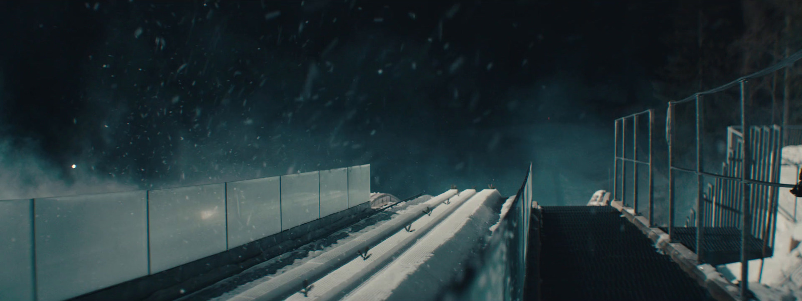 a person walking up a flight of stairs in the snow