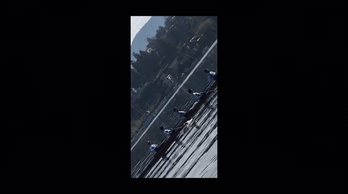 a group of birds sitting on top of a metal fence