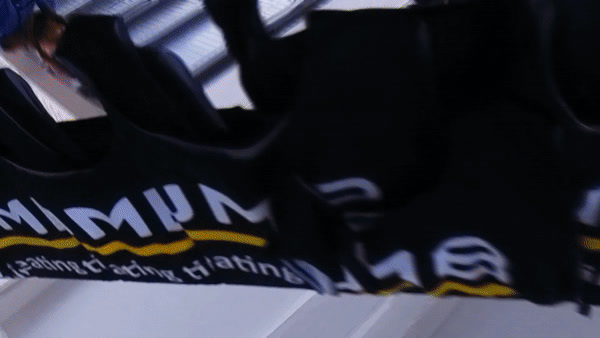 a close up of a bike jersey hanging from a rack