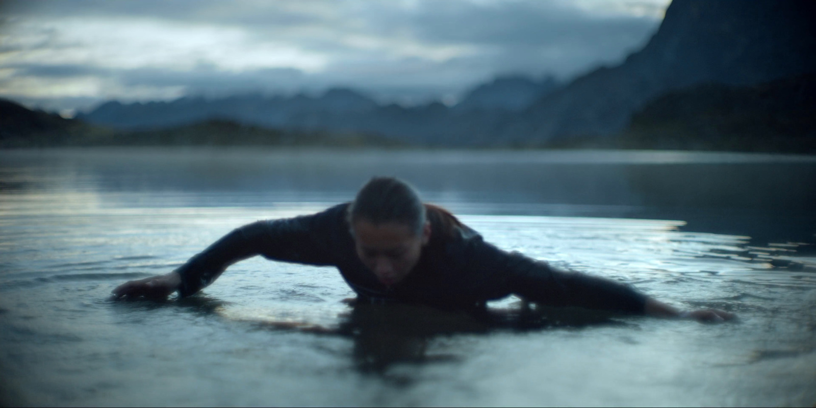 a man in a wet suit is in the water