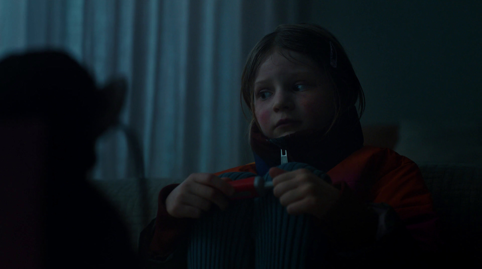 a little girl holding a pair of scissors in her hands