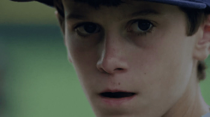 a close up of a baseball player wearing a hat