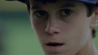 a close up of a baseball player wearing a hat