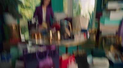 a blurry photo of a woman standing in front of a mirror