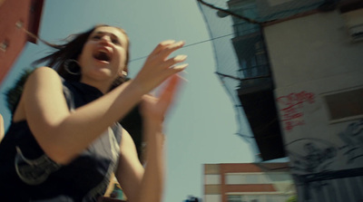 a woman holding a frisbee in her right hand