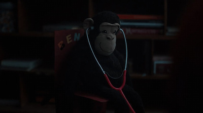 a monkey with a stethoscope in a room