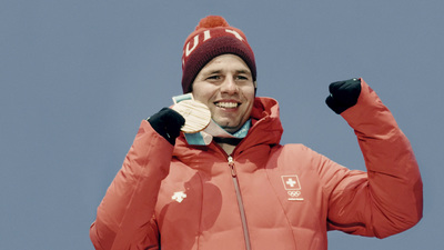 a man wearing a red jacket and a red hat