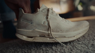 a close up of a person tying a shoelace