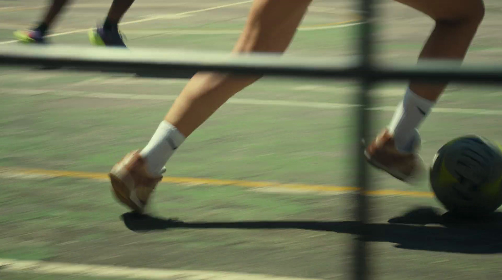 a close up of a person playing tennis on a court