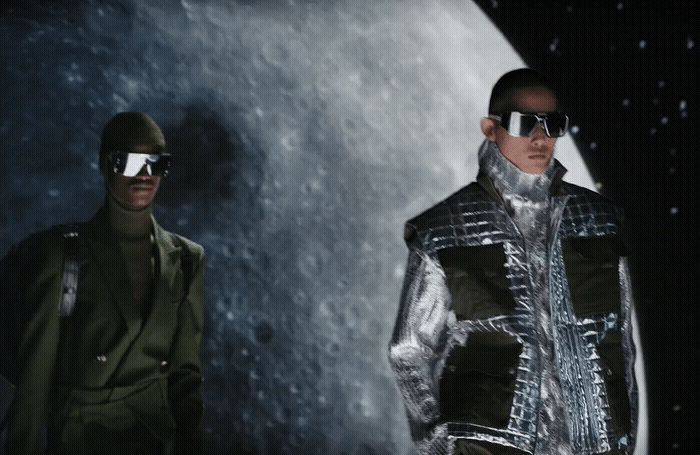 two men in futuristic clothing standing next to each other