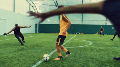 a group of people playing a game of soccer