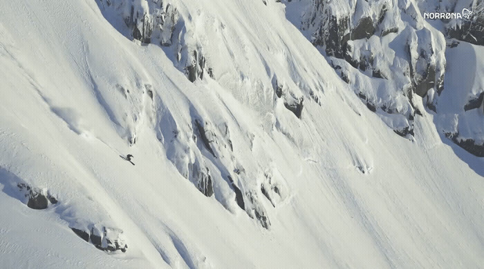 a person skiing down a snow covered mountain