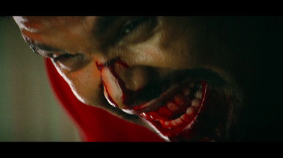 a man with blood on his face and mouth