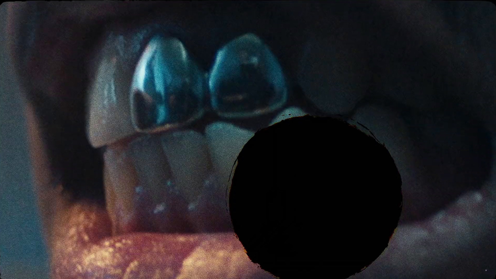 a close up of a person's mouth and teeth