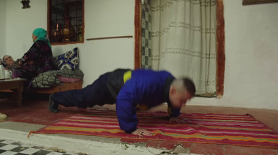 a man is doing a handstand on a rug