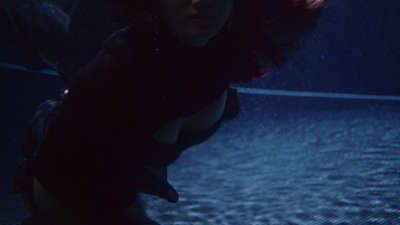 a woman in a wet suit under water