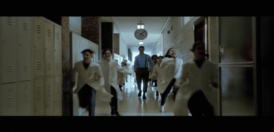 a group of people walking down a hallway