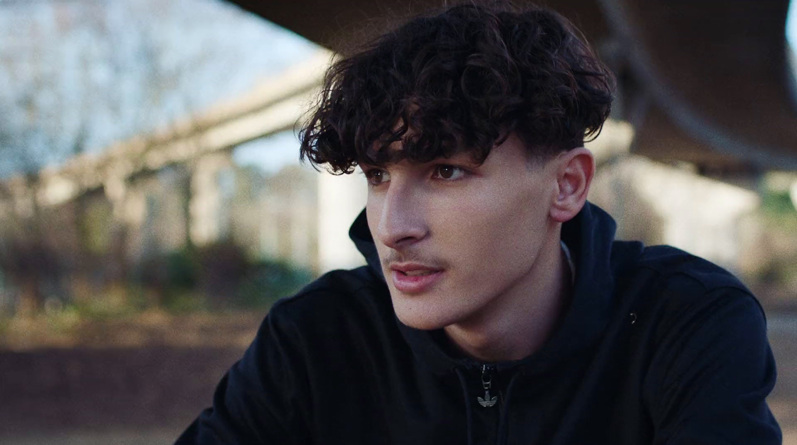 a close up of a person wearing a black jacket