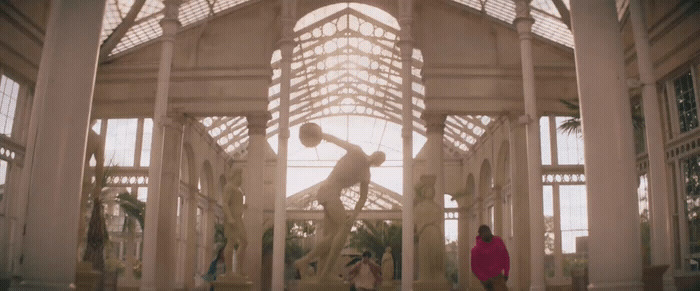 a couple of people that are standing in a building