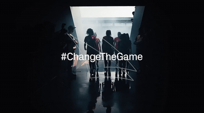 a group of people standing in a dark hallway