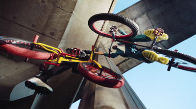 a person on a bike doing a trick in the air