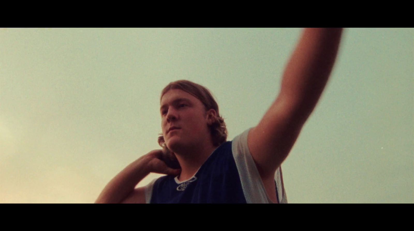 a man holding a tennis racquet on top of a tennis court