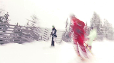 a blurry photo of a person on skis in the snow