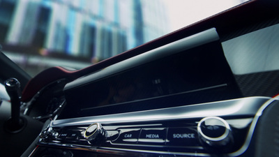 a close up of a car dashboard with a building in the background