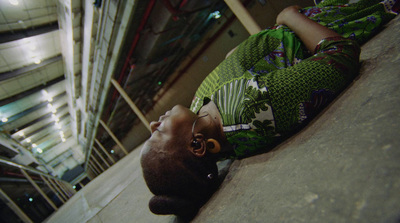 a man laying on the ground with his head down