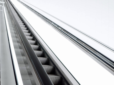 an escalator with two escalators going up and down