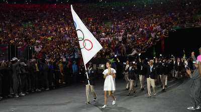 a woman in a white dress holding a white flag