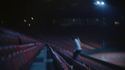 a blurry photo of a person on a tennis court