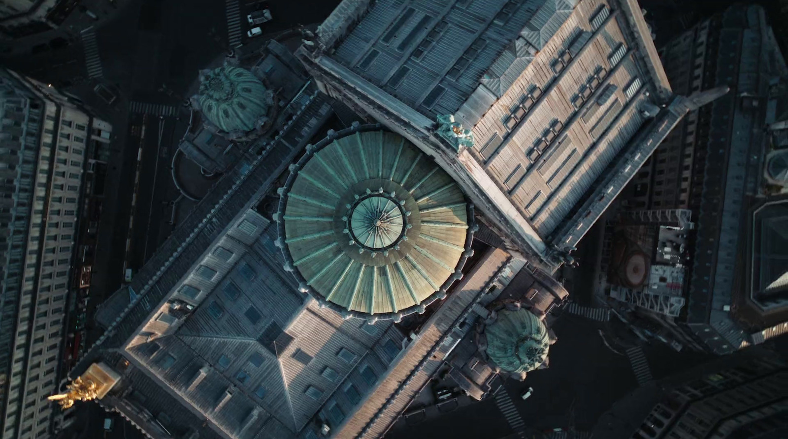 an aerial view of a building with a green dome