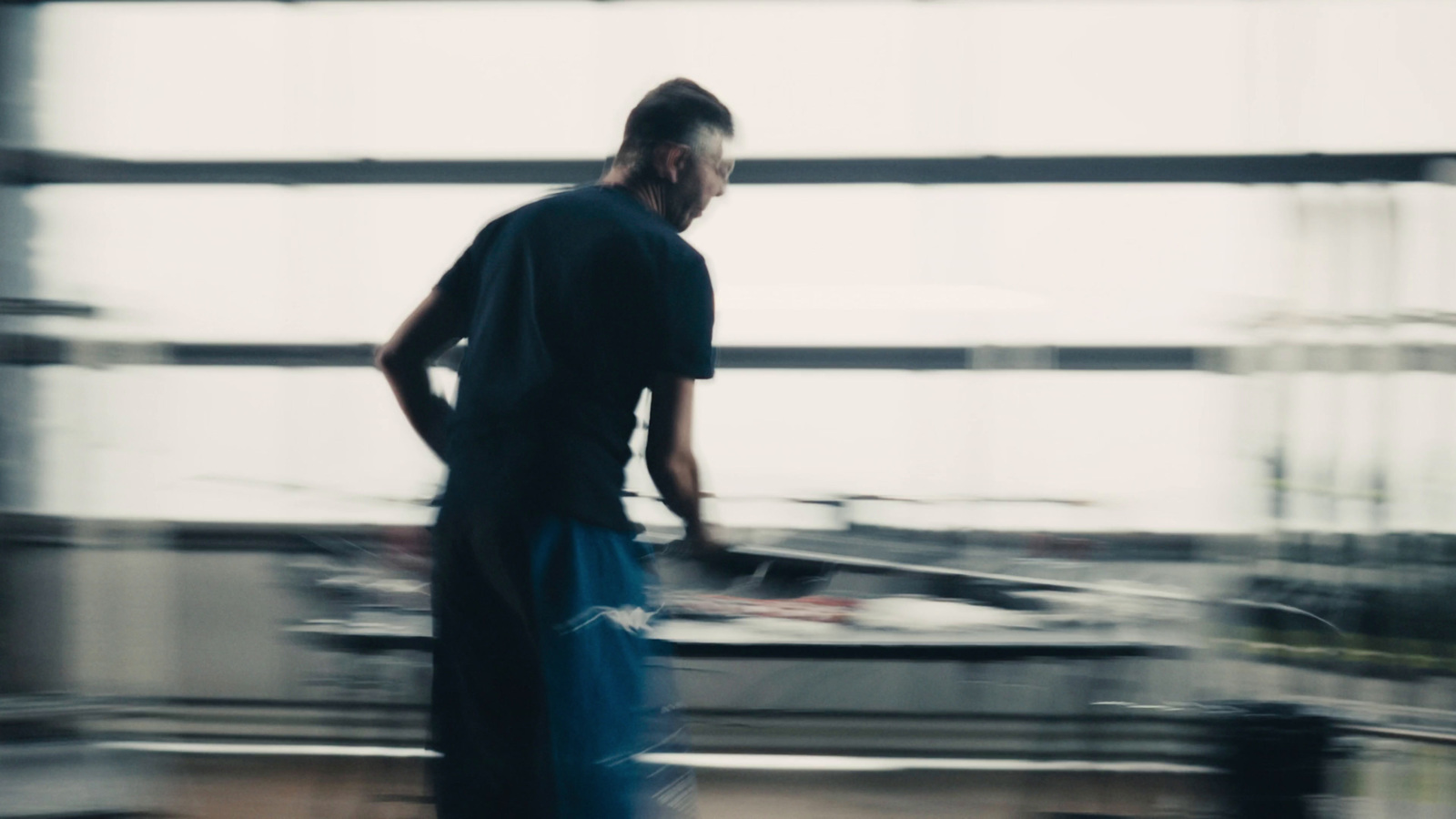 a blurry photo of a man with a skateboard