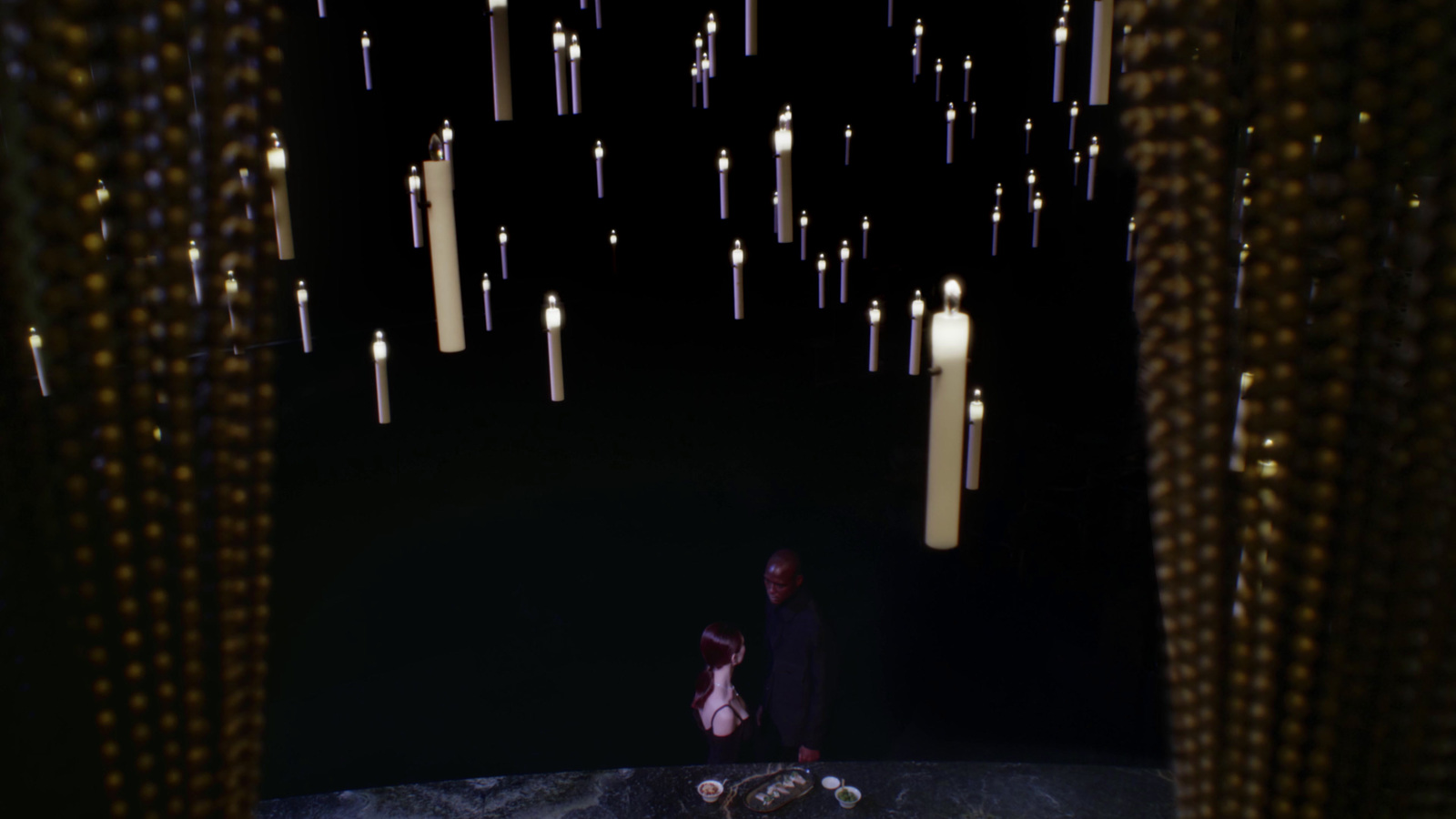 a man sitting on a rock in a dark room