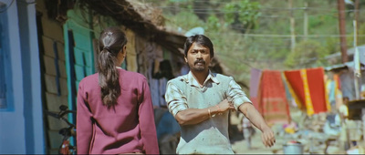 a man standing next to a woman on a street