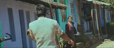 a man and a woman walking down a street