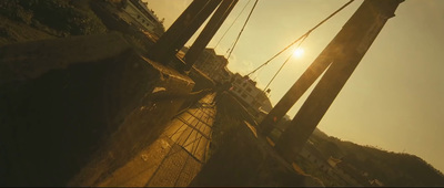the sun shines brightly behind the mast of a sailboat