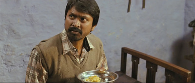 a man holding a bowl of food with a surprised look on his face