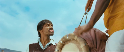 a man holding a drum in his right hand