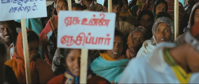 a large group of people holding up signs