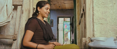 a woman standing in a doorway of a building