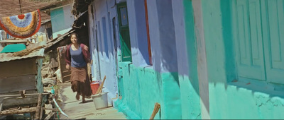 a woman standing in a doorway of a house