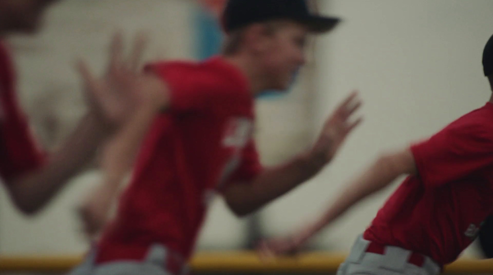 a group of young men playing a game of baseball