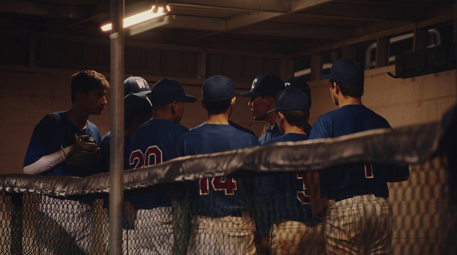 a group of baseball players standing next to each other