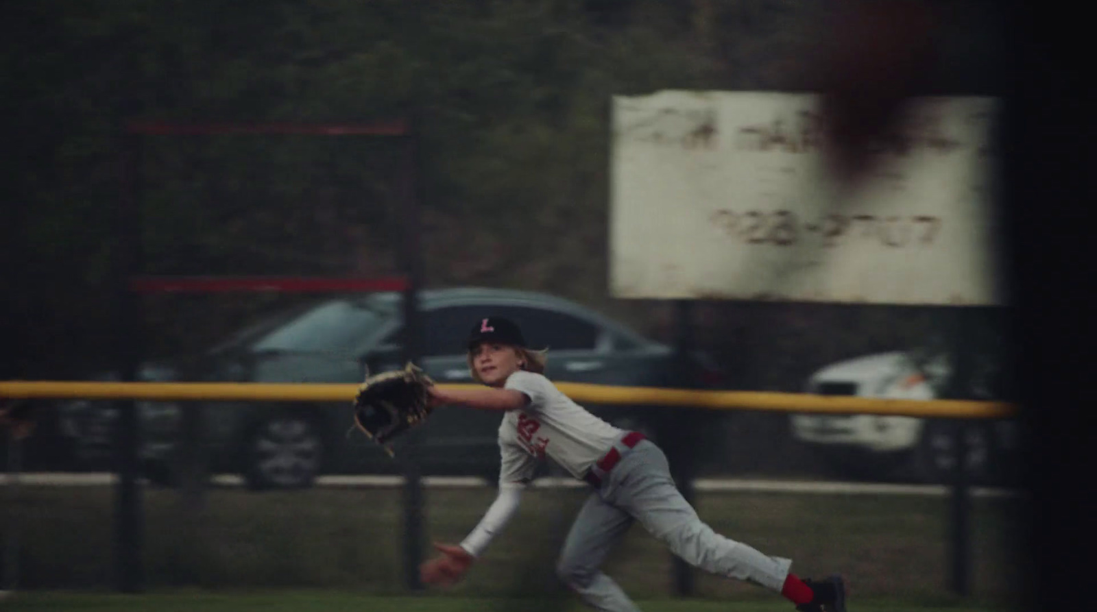 a baseball player throwing a baseball on top of a field